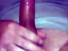 Horny guy moans while jerking his long cock in closeup until cumming