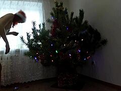 petite amateur dances by christmas tree