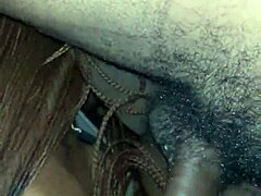 ebony performer in oral scene with facial