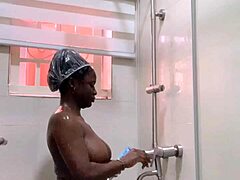 masturbating in the bathroom with shaved body and perky boobs