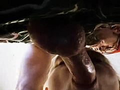 a milf gives deepthroat blowjob in close up.