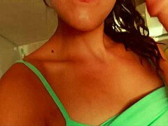 MILF with big boobs performs sex act with sex toy