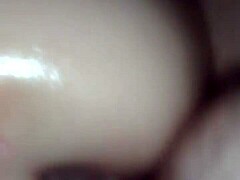 Oiled pussy fucked by cock in detailed scene