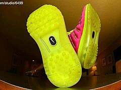 Tall cute girl shows off barefoot feet in nike shoes from pov