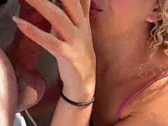 Curly blonde dances funk in kitchen pajamas