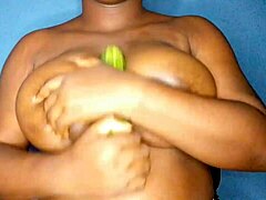 Ebony Woman Sensually Caresses Her Large Black Breasts