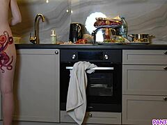 Wow! Naked housewife with octopus tattoo cooks in kitchen ignoring everyone!