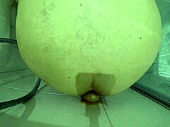 a big slave gets roughly fucked with bloody dildo in shower