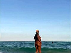 Ebony Milf Enjoys a Steamy Day at the Beach with Natural Curves