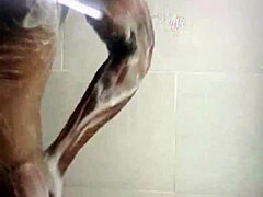 Muscular gay Vietnamese man exercises at the gym