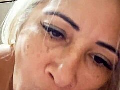 Milf plays with dildo in naked pussy.