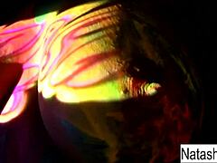 Busty Natasha Nice shoots fun black light video