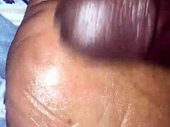 girlfriend gives footjob to boyfriend in bedroom, teasing with feet and hands.