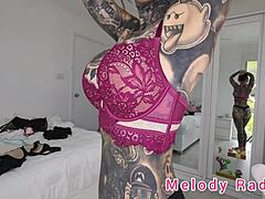 melody radford stuns in black and purple lingerie during sexy micro bikini haul