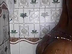 Thick ebony woman fucks and dances in the shower