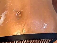 monika fox playing with pink toy in steamy bathroom