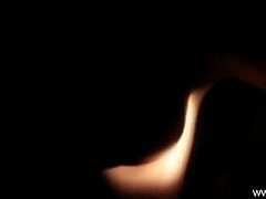 Sensual Dancer Teases Erotically Under Nighttime Lights