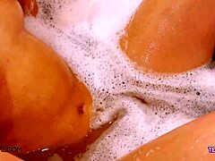 Brunette teen flaunts perfect body in bath