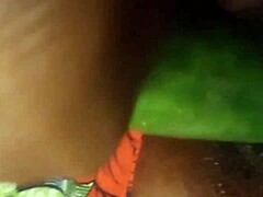 Close up of a black amateur's squirting orgasm during cucumber insertion