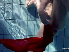 Russian Teen Lucie Swimming Underwater in Pool.