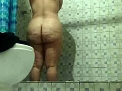 Hidden camera catches mature stepmom in shower moment