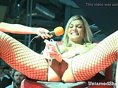 horny slut opens legs at show