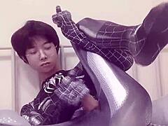 Young gay guy masturbates like Spiderman