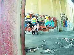 Chubby couple bangs hard against public street wall.