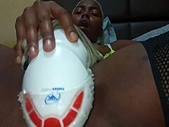 Latina woman plays with pink dildo on bed