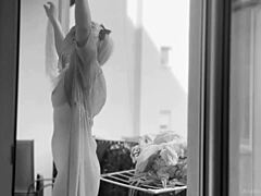 Chubby naked woman hangs laundry on balcony for neighbors to see. What a view!