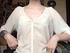 Woman removes underwear on camera revealing smooth pussy for masturbation