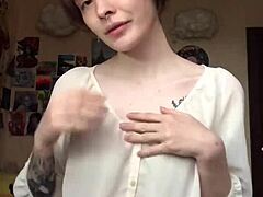 Woman removes underwear on camera revealing smooth pussy for masturbation