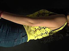 Sexy Outfit and Long Nails Move to Music's Rhythm in Sultry Dance.