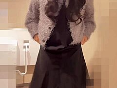 Black-haired Japanese ladyboy masturbates quietly in public toilet