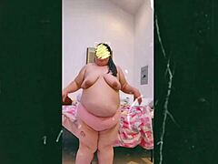 Mature woman dances topless on webcam