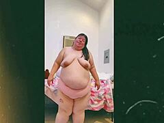 Mature woman dances topless on webcam