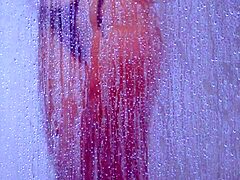 gorgeous tanned college girl showers in tiny bikini