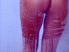 gorgeous tanned college girl showers in tiny bikini