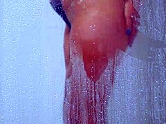 college tanned gorgeous girl feels relaxed taking a shower in her bikini