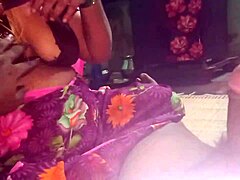 Aunty gives a handjob to her boyfriend's cock in the dorm