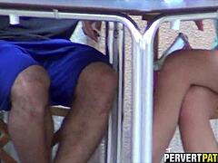 filming a couple through the window in outdoor amateur setup