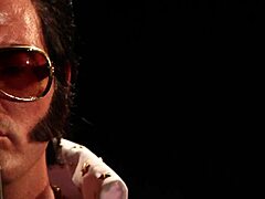 Blonde in Elvis parody engages in MMF threesome with blowjob and spitting