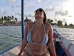 brazilian latina wife rides in bikini on boat