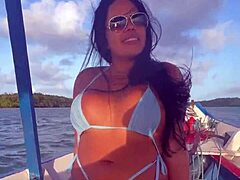 brazilian latina wife rides in bikini on boat