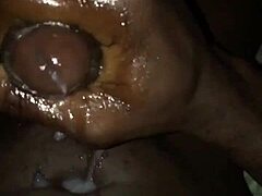 Guy listens to his big black cock sounds while masturbating solo.