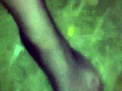 in the woods wearing only g-string and fishnet stockings