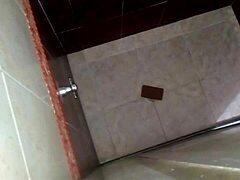 Conversational Shower spy cam catches horny friend licking pussy in bathroom voyeur action
