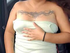 Latina whore showing tits and panties in car on highway