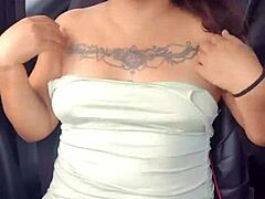 Latina whore showing tits and panties in car on highway