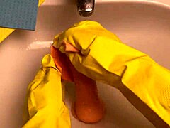 Hot housewife washes dildo after using it in her pussy!